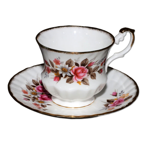 Royal Minster Footed Teacup and Saucer with Pink Roses and Gold Edging